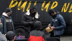 Ed Howard Signs Ball Next To Heyward And Hoerner